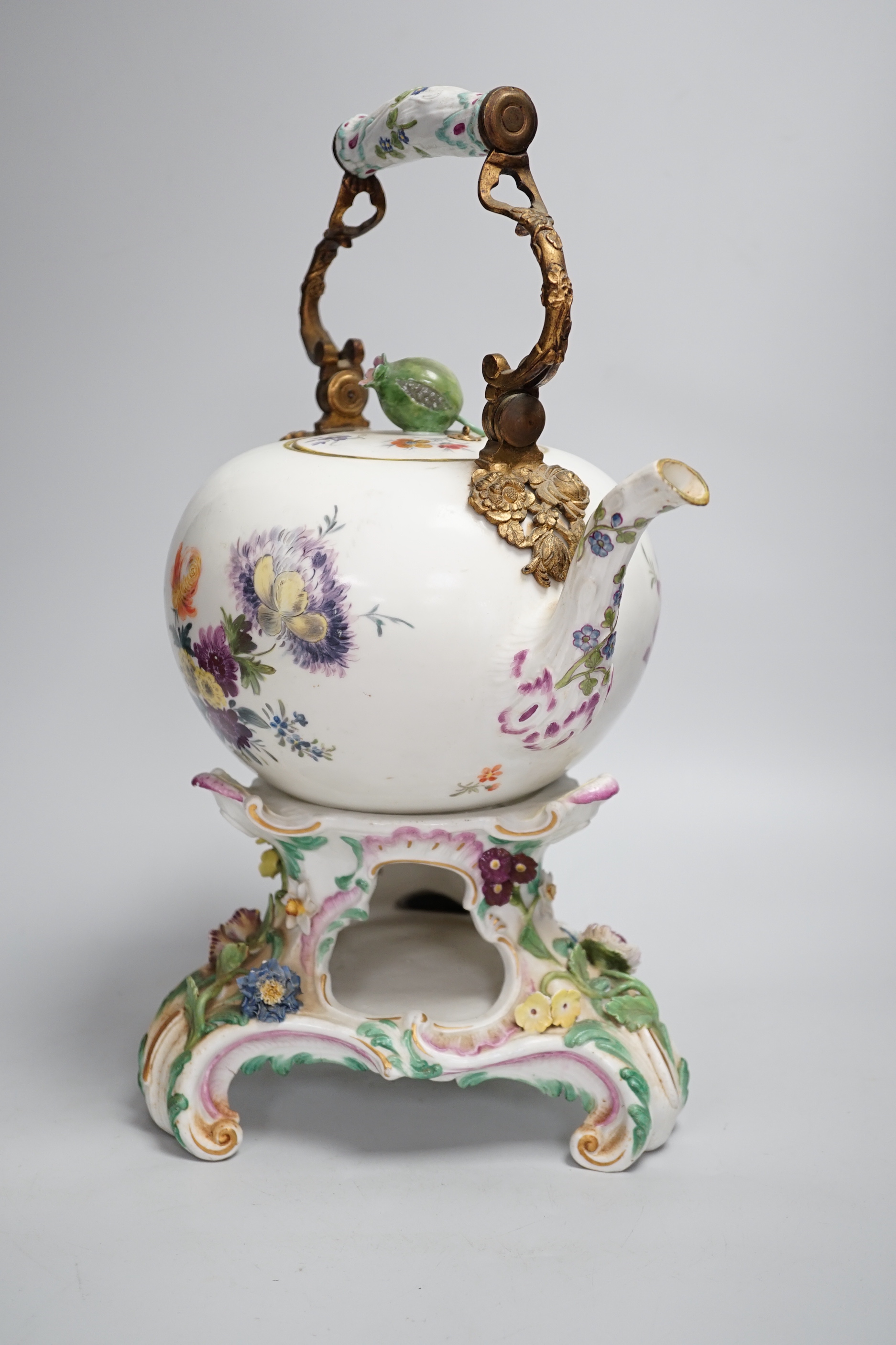 A mid 18th century Meissen teapot on a later Dresden stand with brass handle and floral decoration, height on stand 38cm